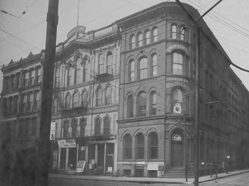 Lafayette Hall is next door to the bank on the corner in this photo, circa 1890.